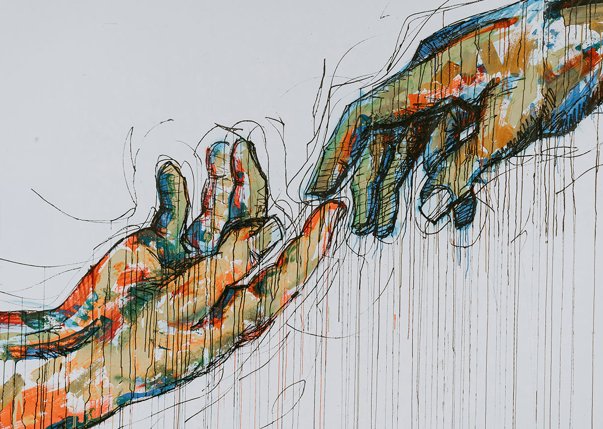 Zwei menschliche Hände gemalt an einer Wand
